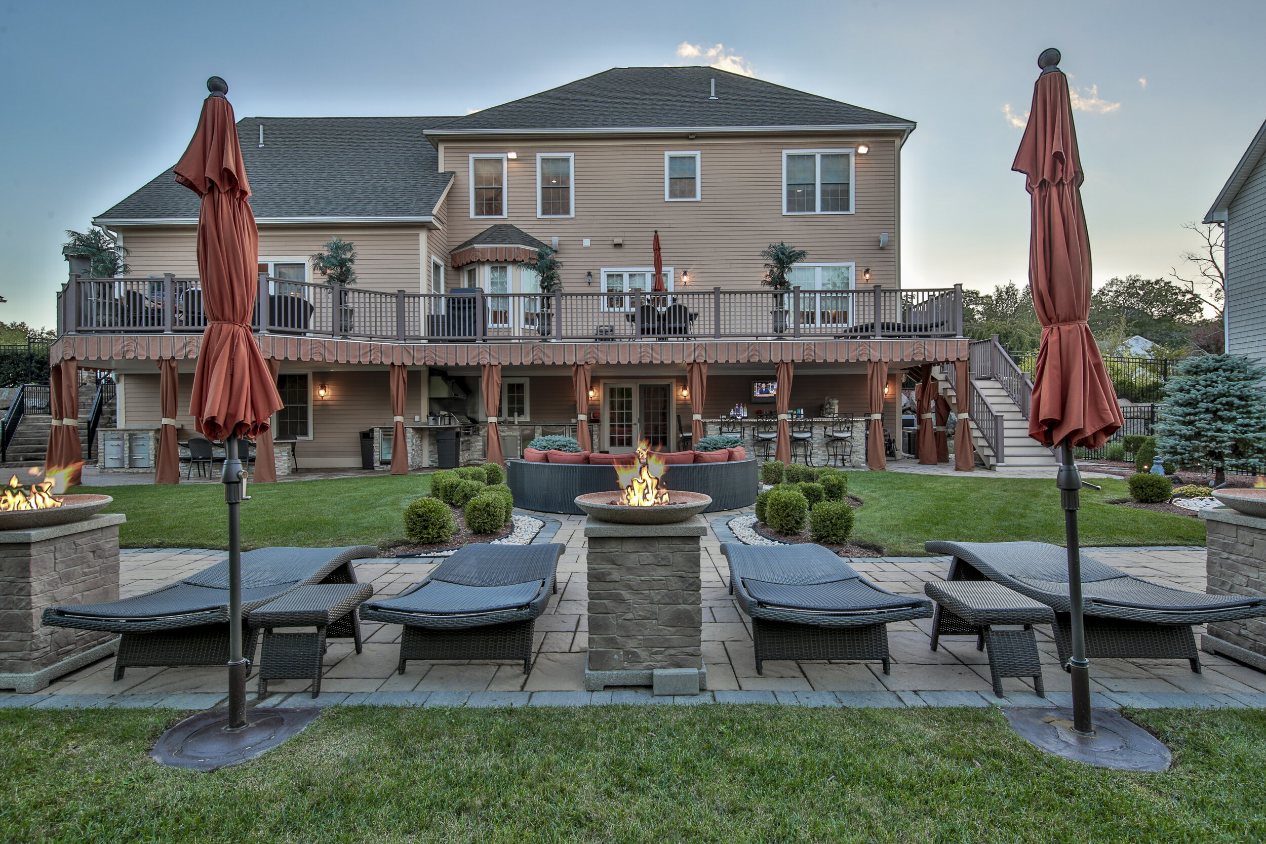 A backyard centred on a fire pit.